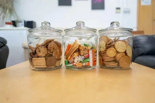 picture of our sitting room with cookies and chocolate in glass jars