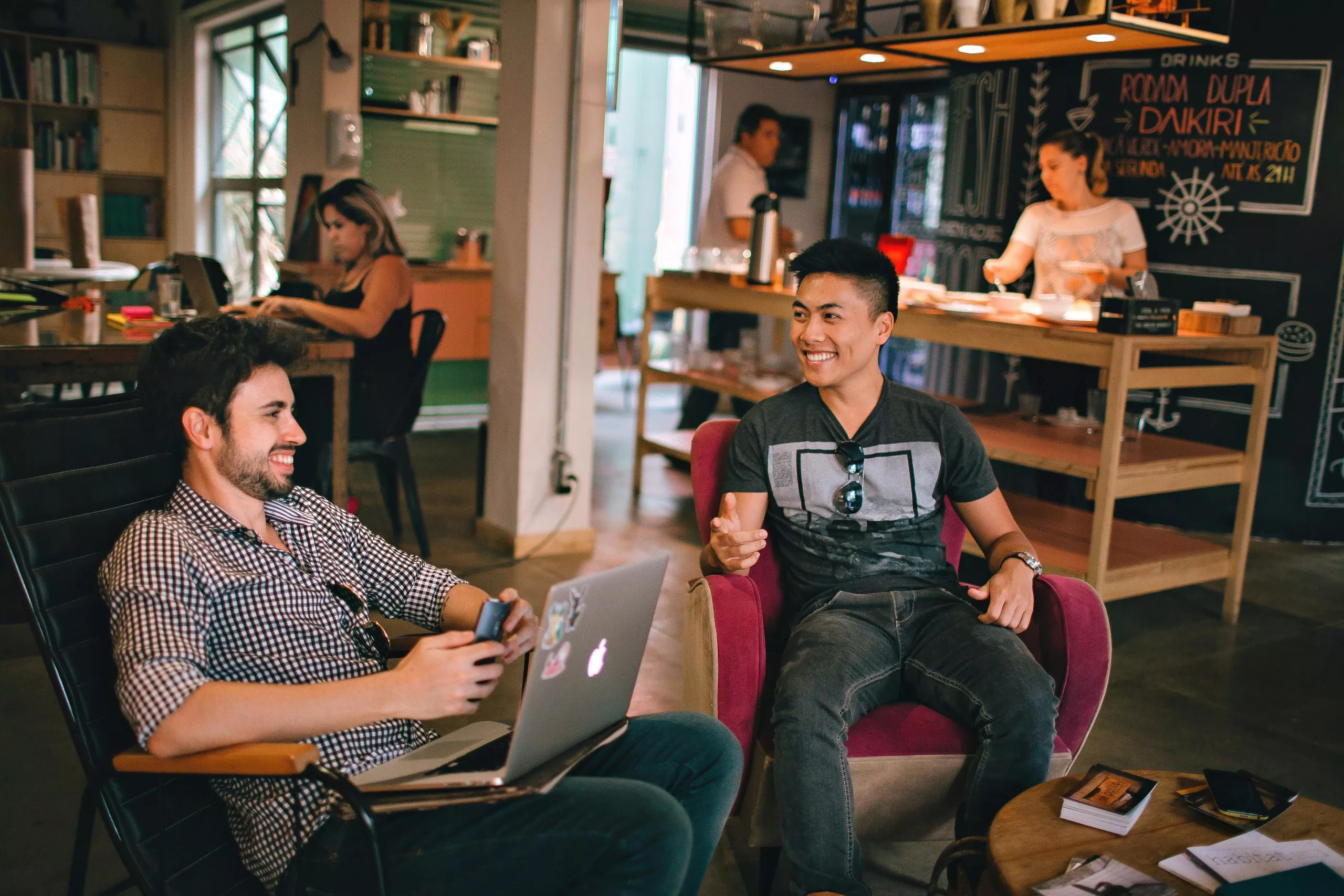 People having fun conversation in workplace
