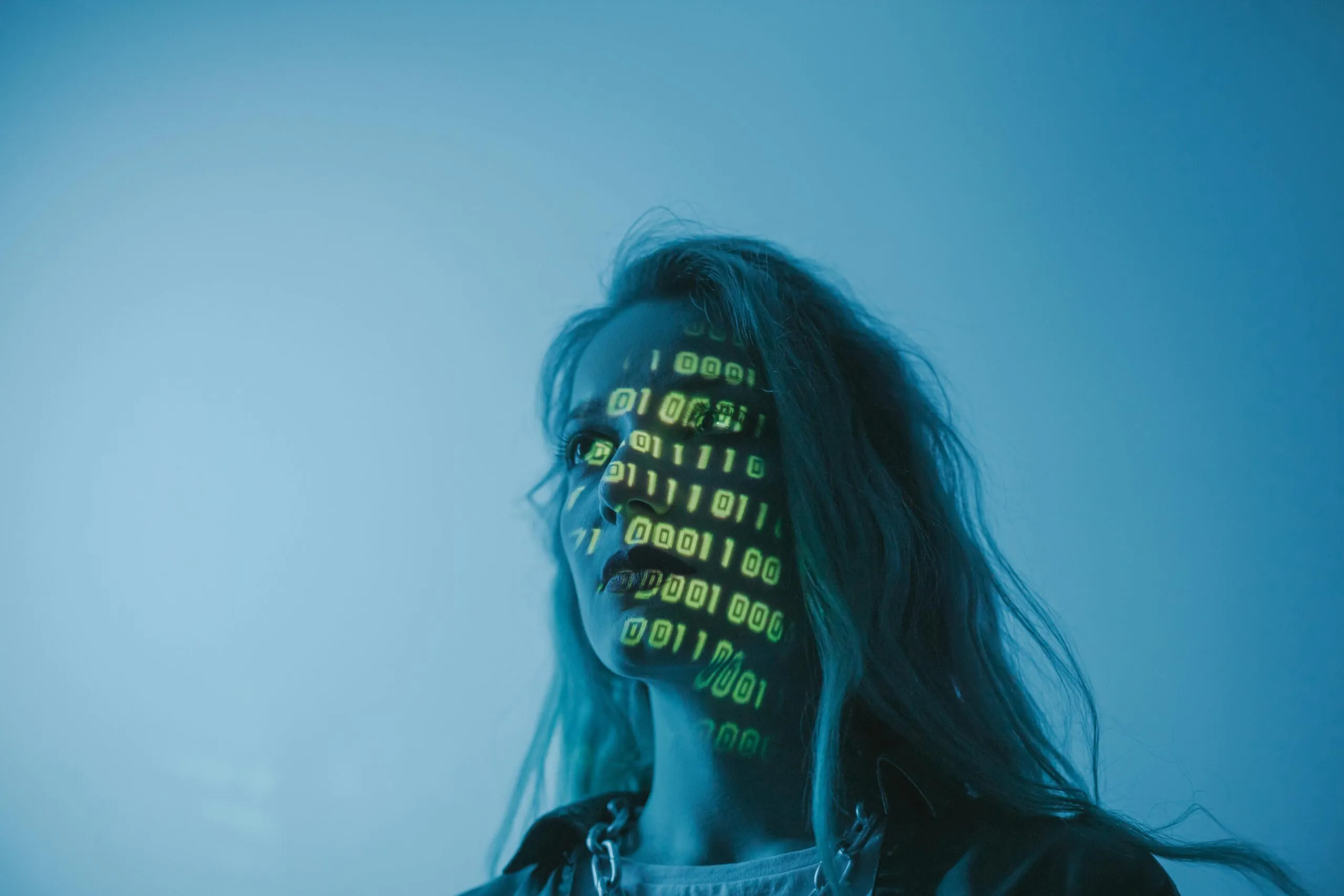 Futuristic style image with data being shown on a womans face