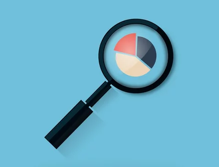 Magnifying glass zooming in on chart